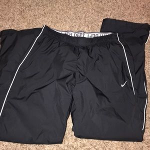 Black Nike windbreaker pants